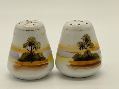 Mid century, white and orange ceramic salt/pepper shaker featuring a tree-image