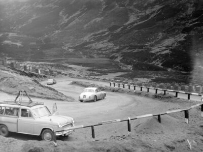 P G Walton R Joss' Jaguar MkII follows another MkII on a steep hill 1960 Photo-image
