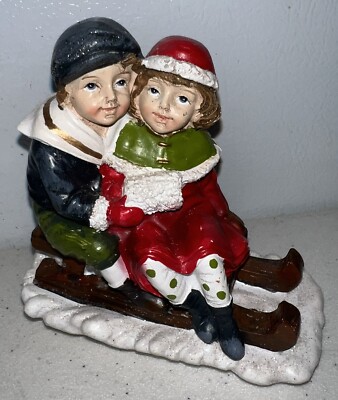 Creative Co-Op Christmas Vintage Resin Children Sled Figurine NBL01B-image