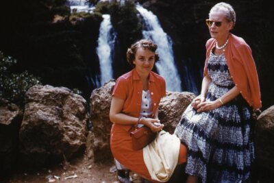 35mm Slide 1950s Orange Border Kodachrome Women on Cliff Waterfall in Background-image