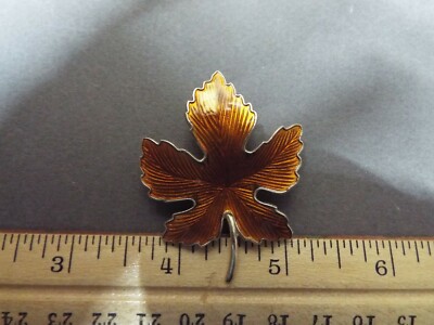 VINTAGE MID CENTURY ORANGE ENAMEL MAPLE LEAF PIN-image