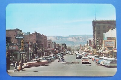 Postcard 1950s Main Street Grand Junction CO Cars Mesa Theatre Fort Dobbs V Mayo-image